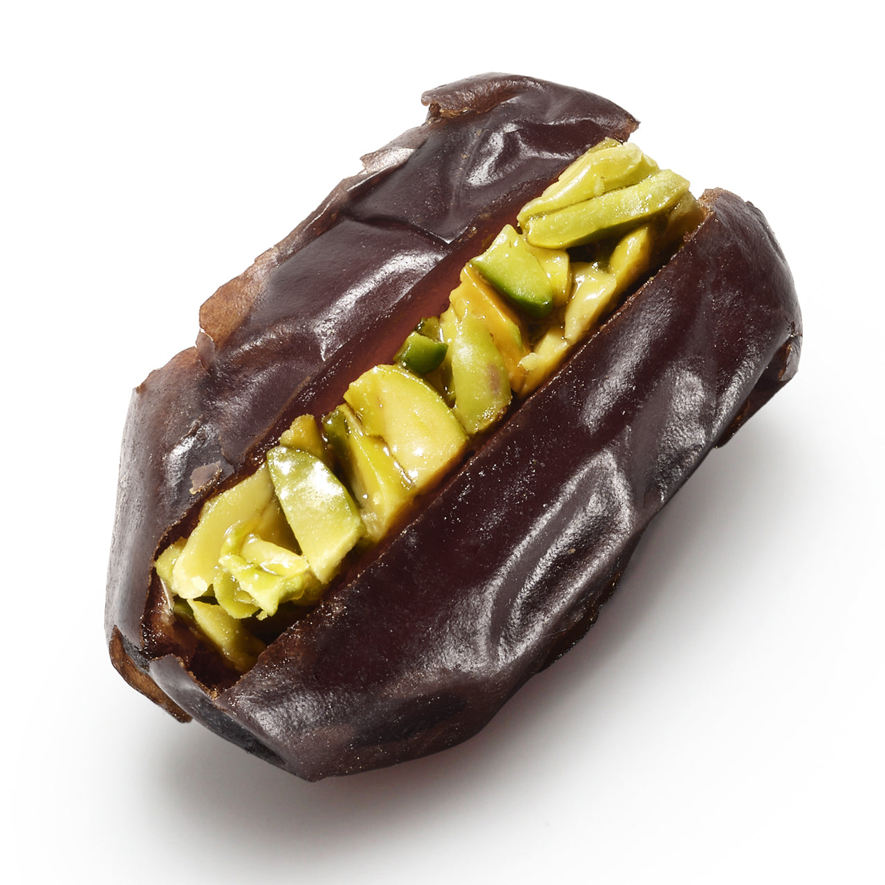 One of What a Date's dark hand-filled dates with thick slivers of Sicilian pistachio — the What a Date Pistachio signature is the gently baked shavings in an artisanal date syrup. The dates are always hand-pitted to keep the flesh intact and therefore also the fiber content. 